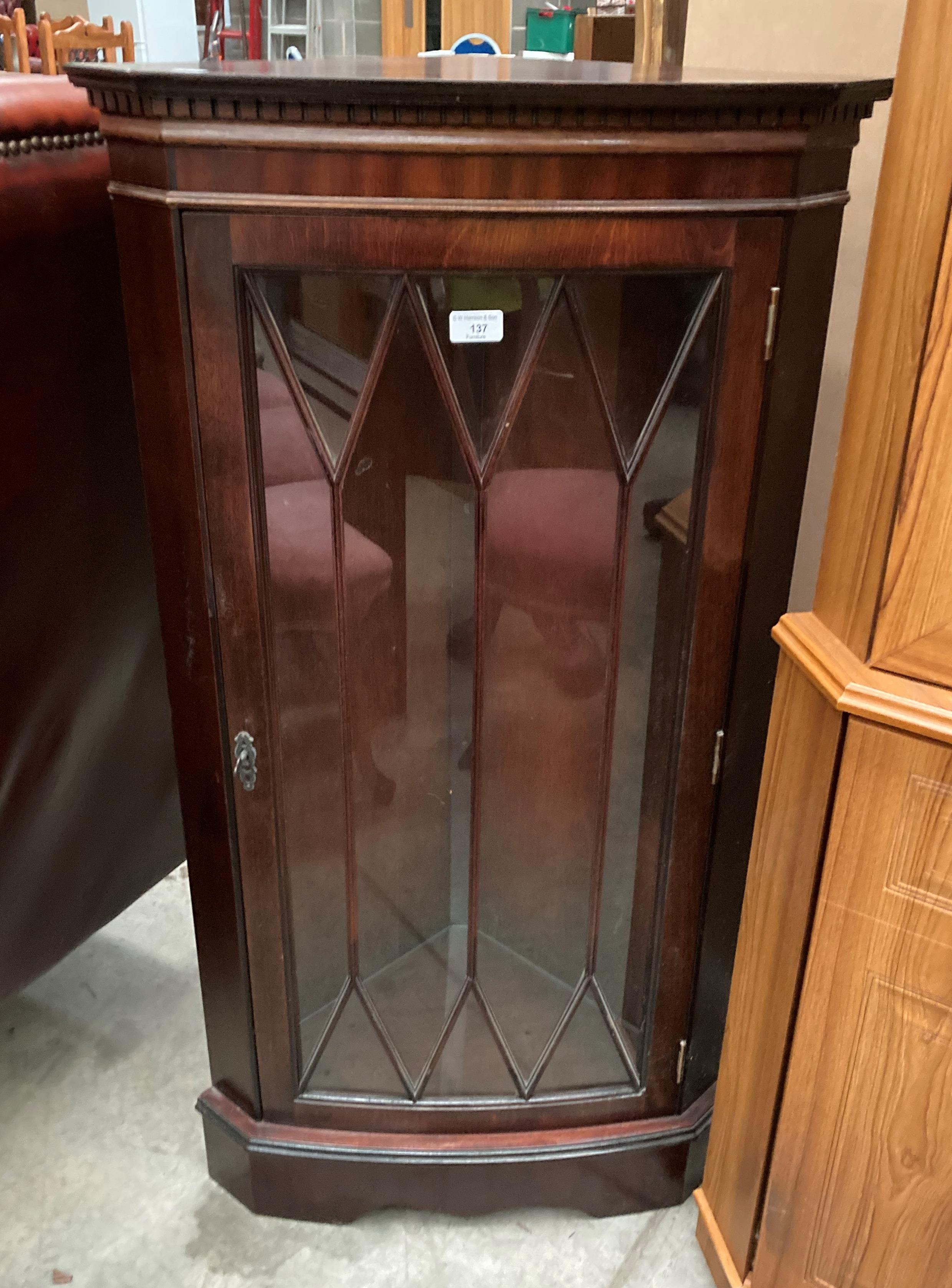 A mahogany floor standing corner cabinet with single Astragal glazed door 60cm x 109cm high