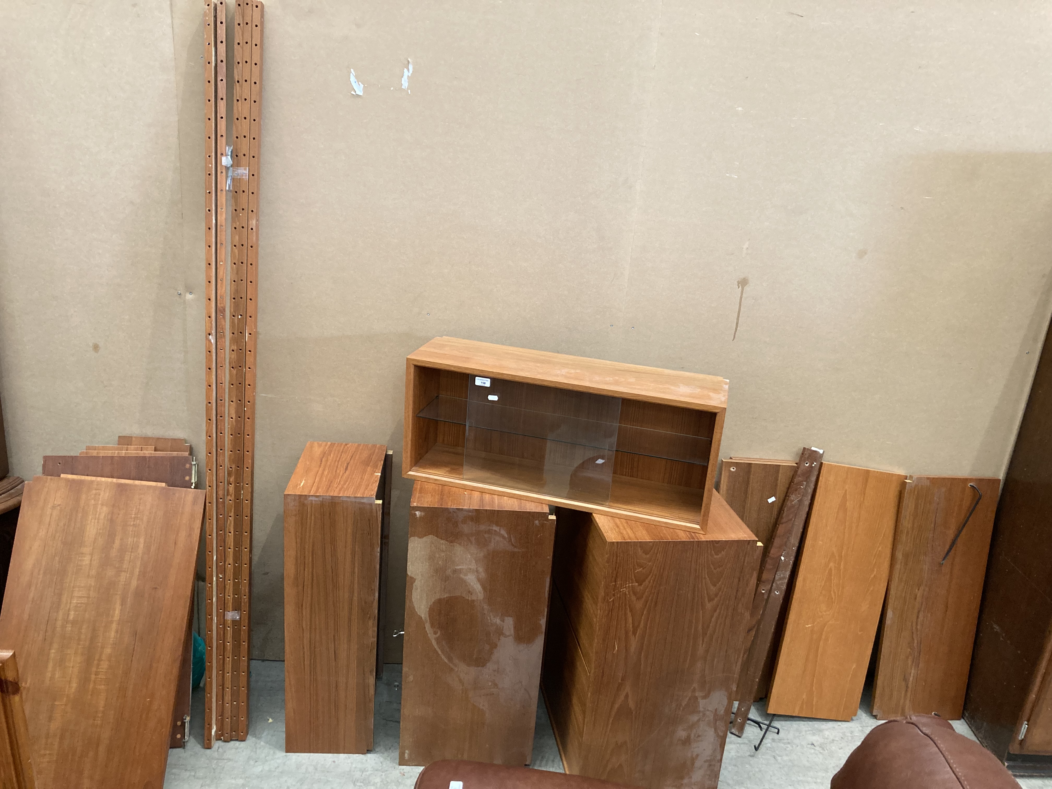 A mid Twentieth Century teak wall mounting unit - sold dismantled and as seen - no image showing it