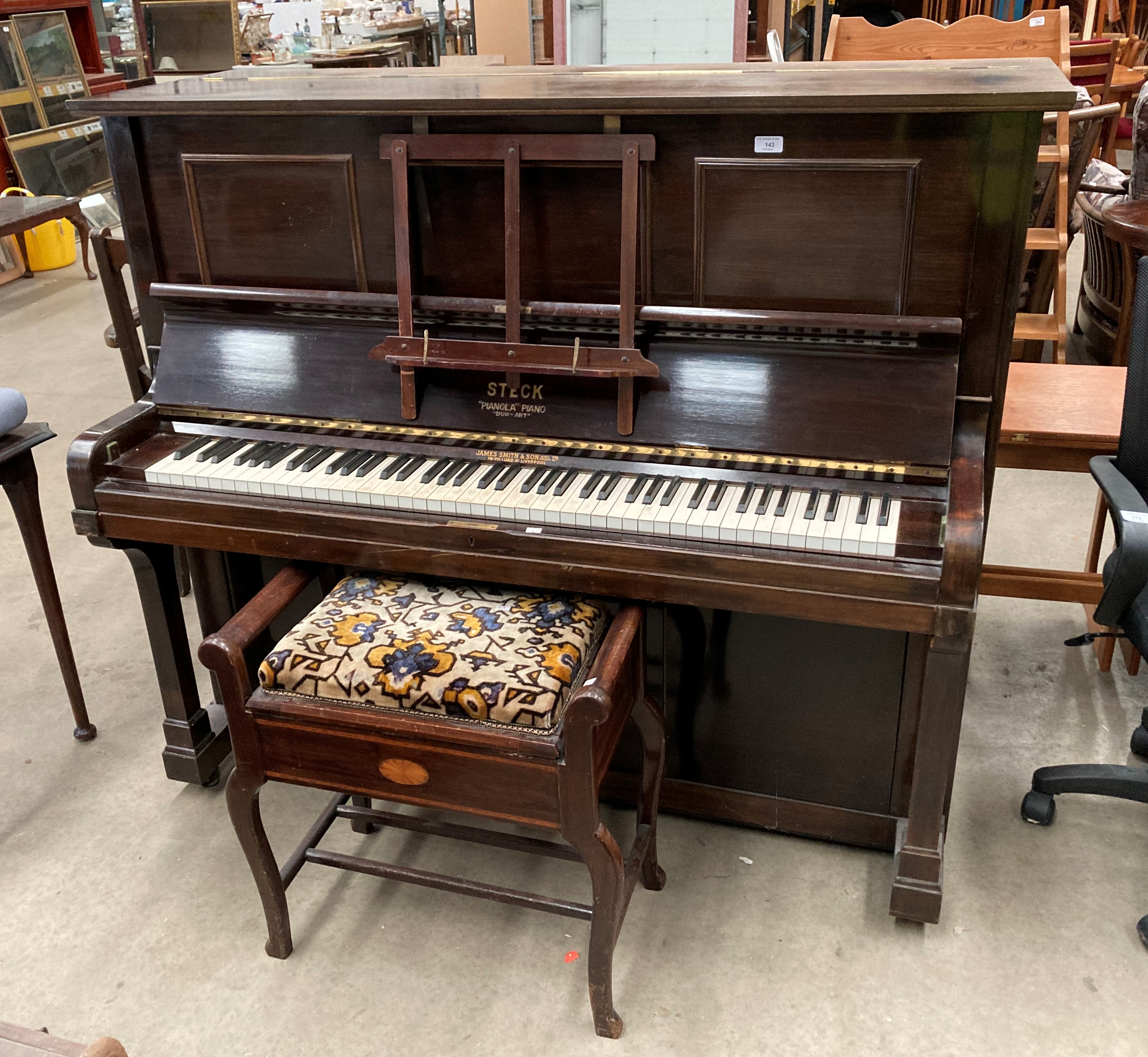 A Steck mahogany cased iron framed 'Pianola Duo-Art' piano 140cm retailed by James Smith and Son,