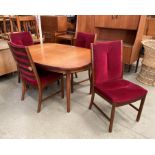 A teak 'D' ended extending dining table 100cm x 200cm and four teak dining chairs with maroon