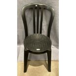 A set of four Grossiflex black plastic stacking cafe/outdoor chairs