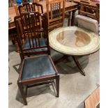 A circular mahogany single pedestal coffee table with protective glass top 90cm diameter and a pair