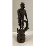 A figurine of Pecheur a fisher man with catch made of spelter on a wooden base - 38cm high (SR3)