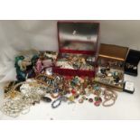 Large quantity of costume jewellery in five boxes and silver plated cigarette box.