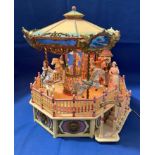 "Carousel Royale" with deluxe action and illuminated musical carousel by Enesco Small World of