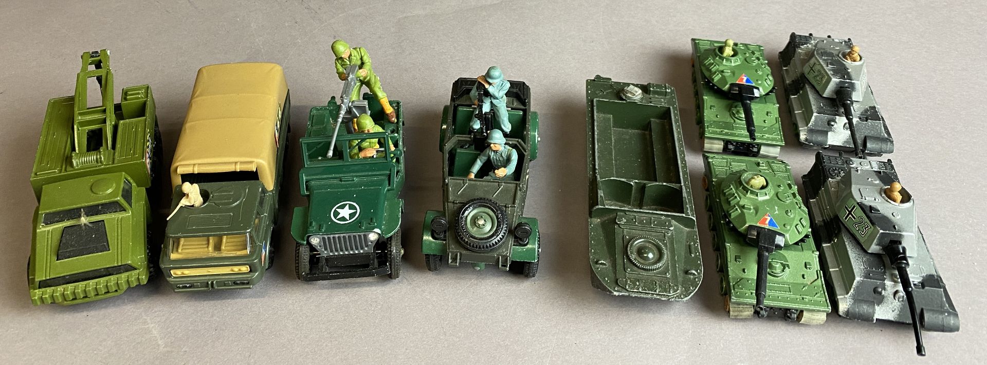 Nine assorted metal model military vehicles including Kubelwagen Jeep,