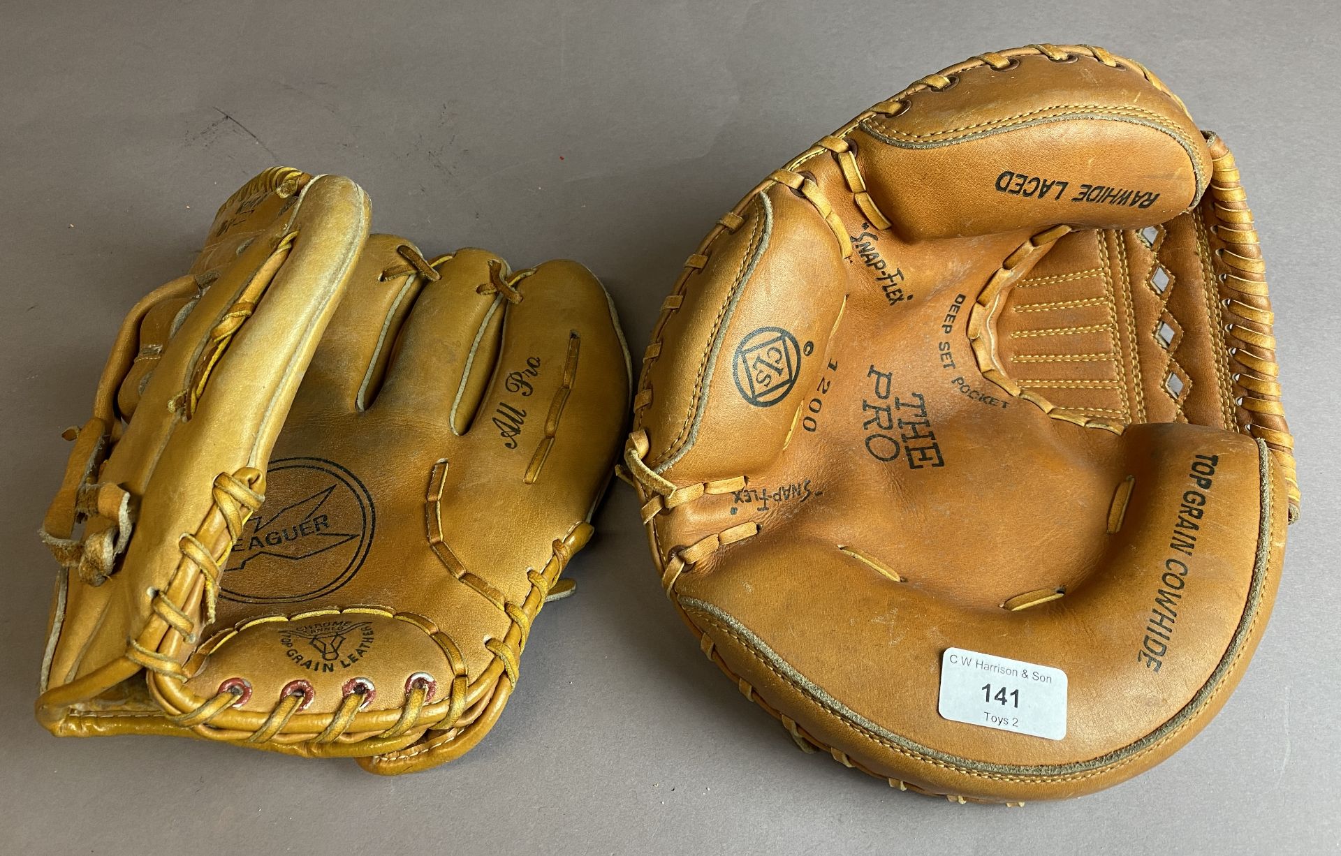 Two leather All Pro baseball gloves (S3 T5)