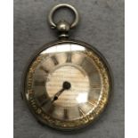 A silver pocket watch with silver dial and gold coloured numerals