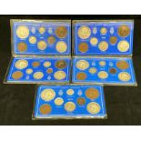 Five Great Britain packaged King George V eight piece coin sets, 1911-1915.