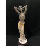 A Florence Guiseppe Armani figurine of a half naked female with signature to base 44cm high