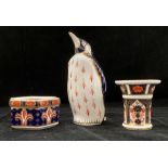 A Royal Crown Derby 'penguin' paper weight with coloured stopper 14cm high,