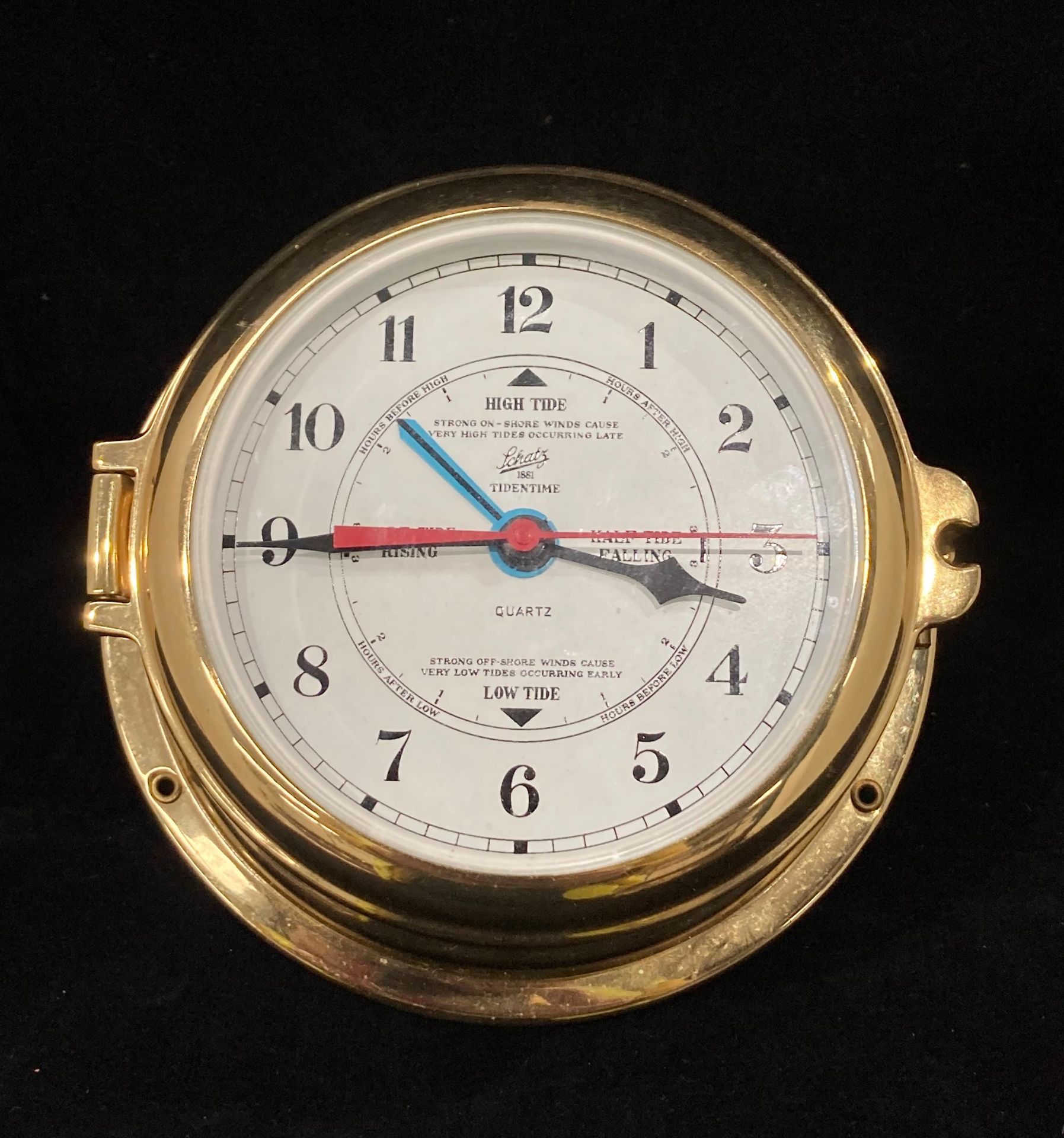 A Shatz Tidentime battery operated Tidal clock in brass porthole style case 11cm diameter