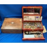 A wood jewellery box containing black bead necklace, diamante, simulated pearl and other necklaces,