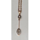 A 15ct gold two stone drop pendant on a 9ct neck chain in fitted case.