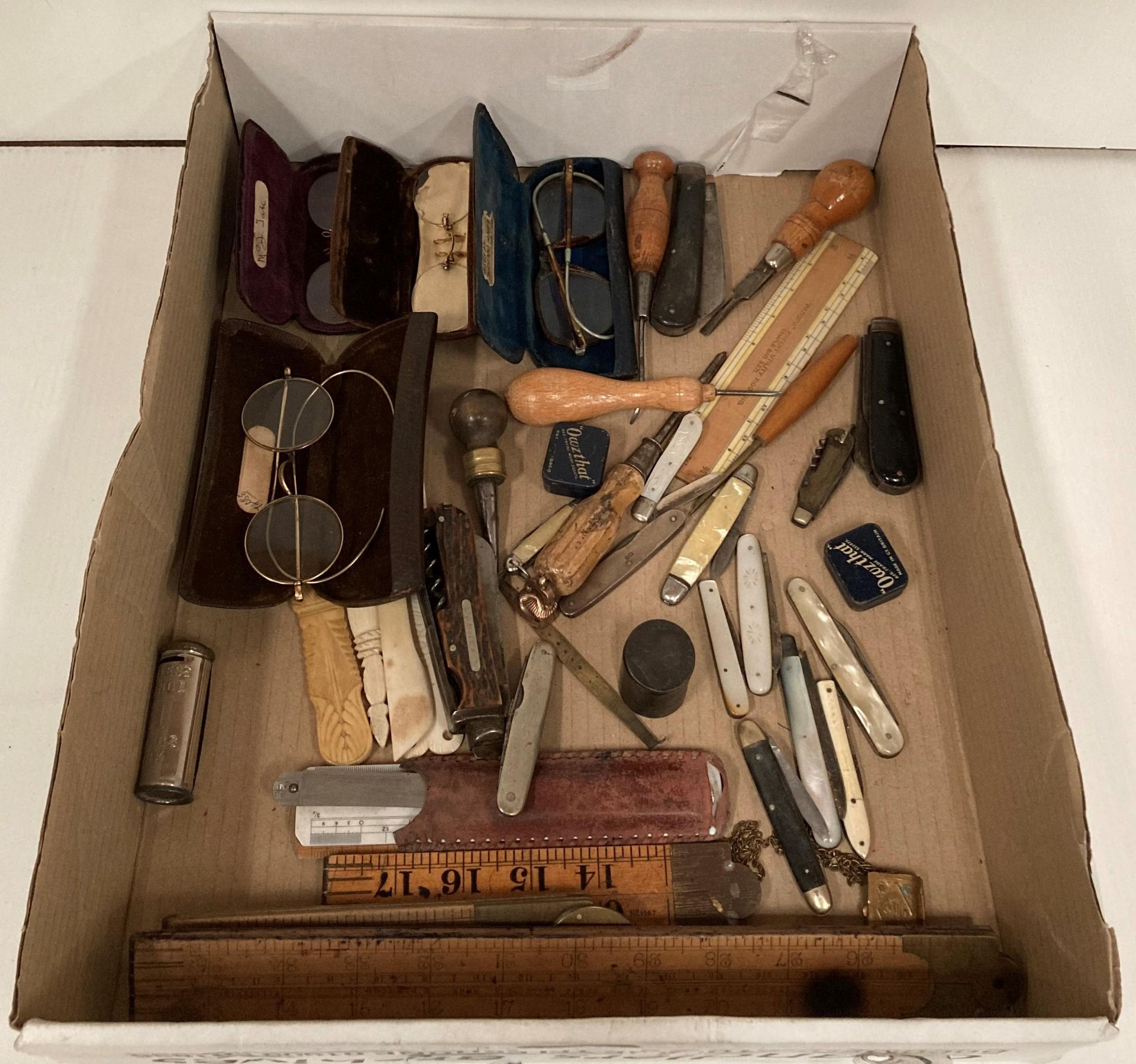 Ten pen knives (some silver), four pairs of vintage glasses, assorted rulers/measuring devices.