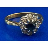 AN 18ct yellow gold round sapphire and eight diamond cluster ring - total weight 2.