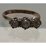 An 18ct gold three stone diamond ring, ring size L - total weight 3 grams.