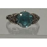 An 18ct gold blue stone and diamond chip ring, size P - total weight 4.9 grams.