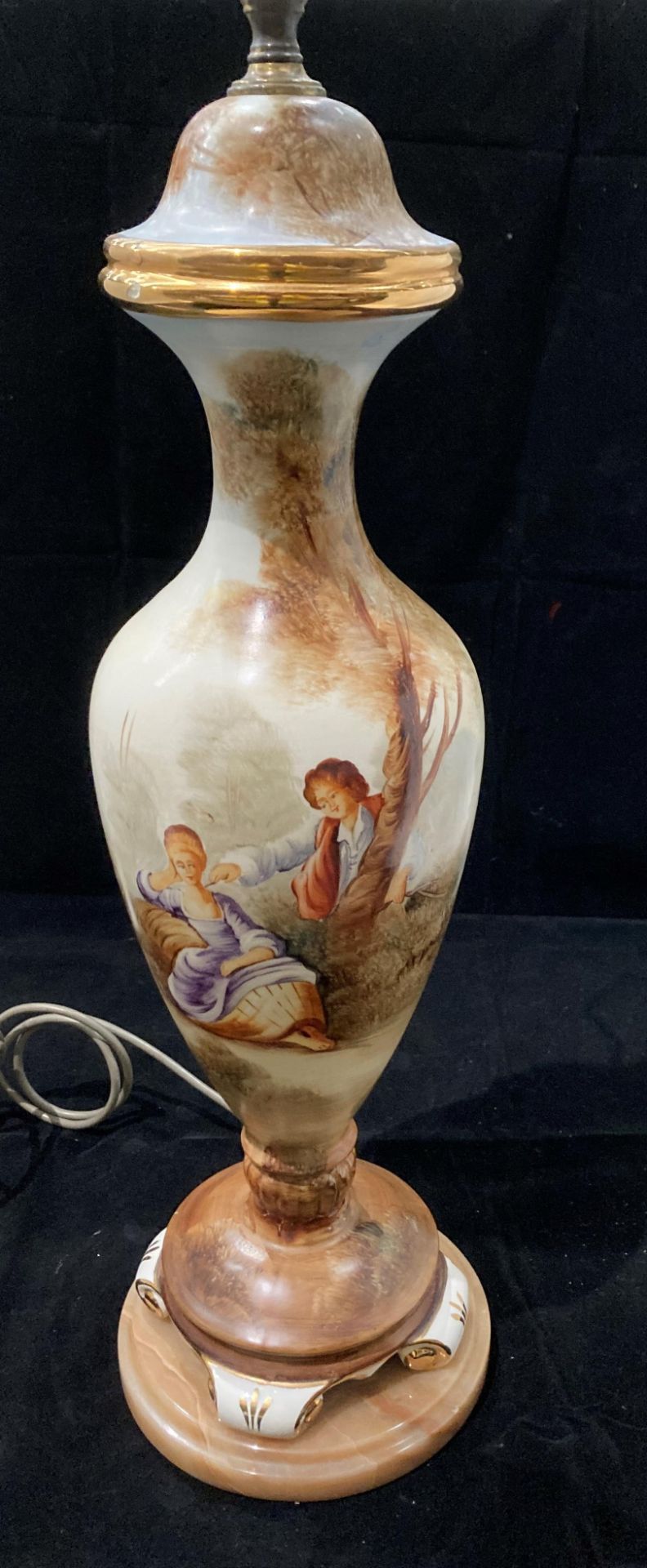 A continental style Porcelain table lamp on onyx base with coloured scene of young lovers in a