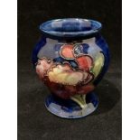 A small Moorcroft blue anemone glazed vase 8.