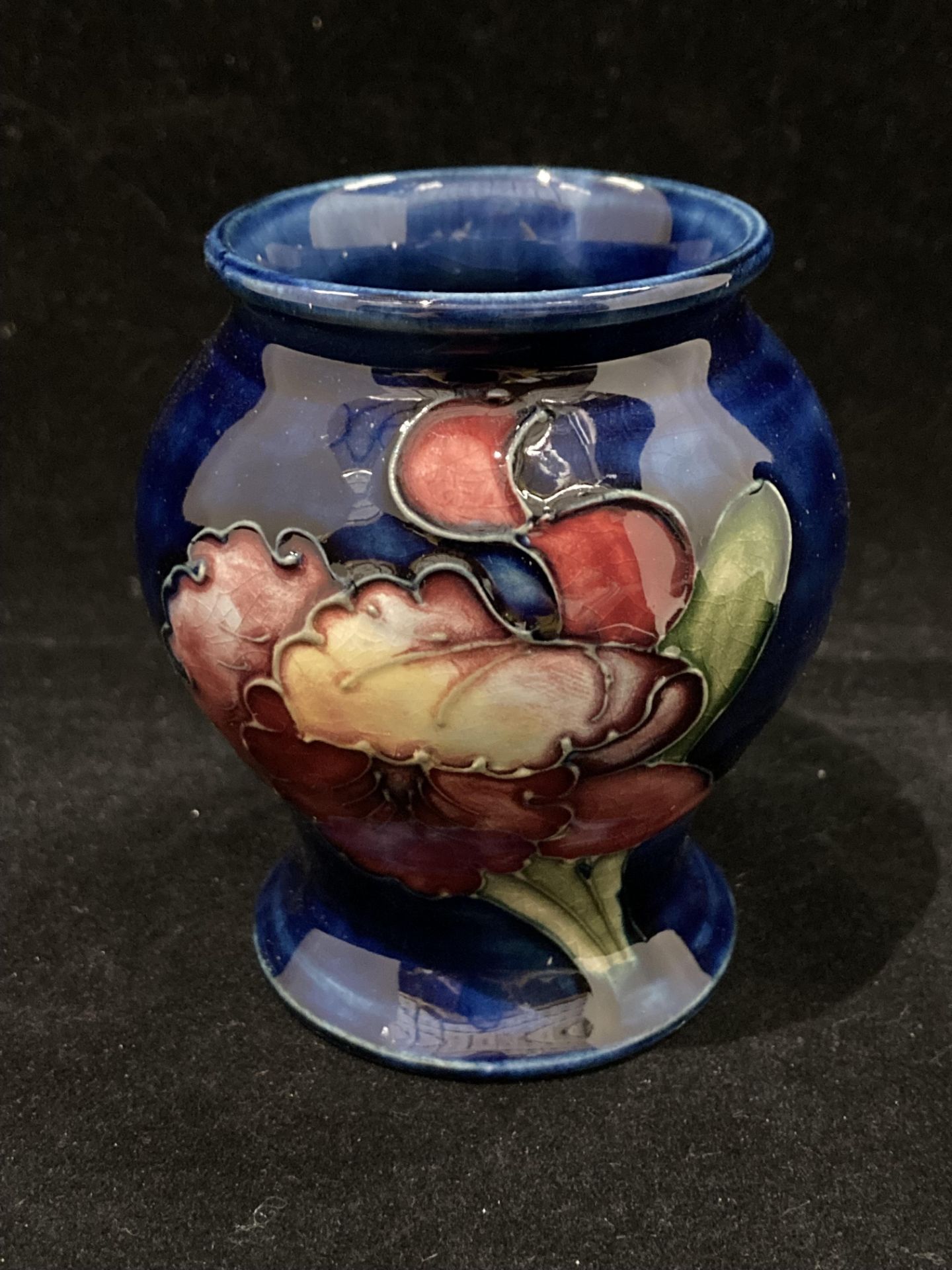 A small Moorcroft blue anemone glazed vase 8.