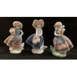 Three Lladro figurines of girls all holding baskets or buckets of flowers, Nos: 5221, 5222,
