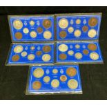 Five Great Britain packaged King George V eight piece coin sets.