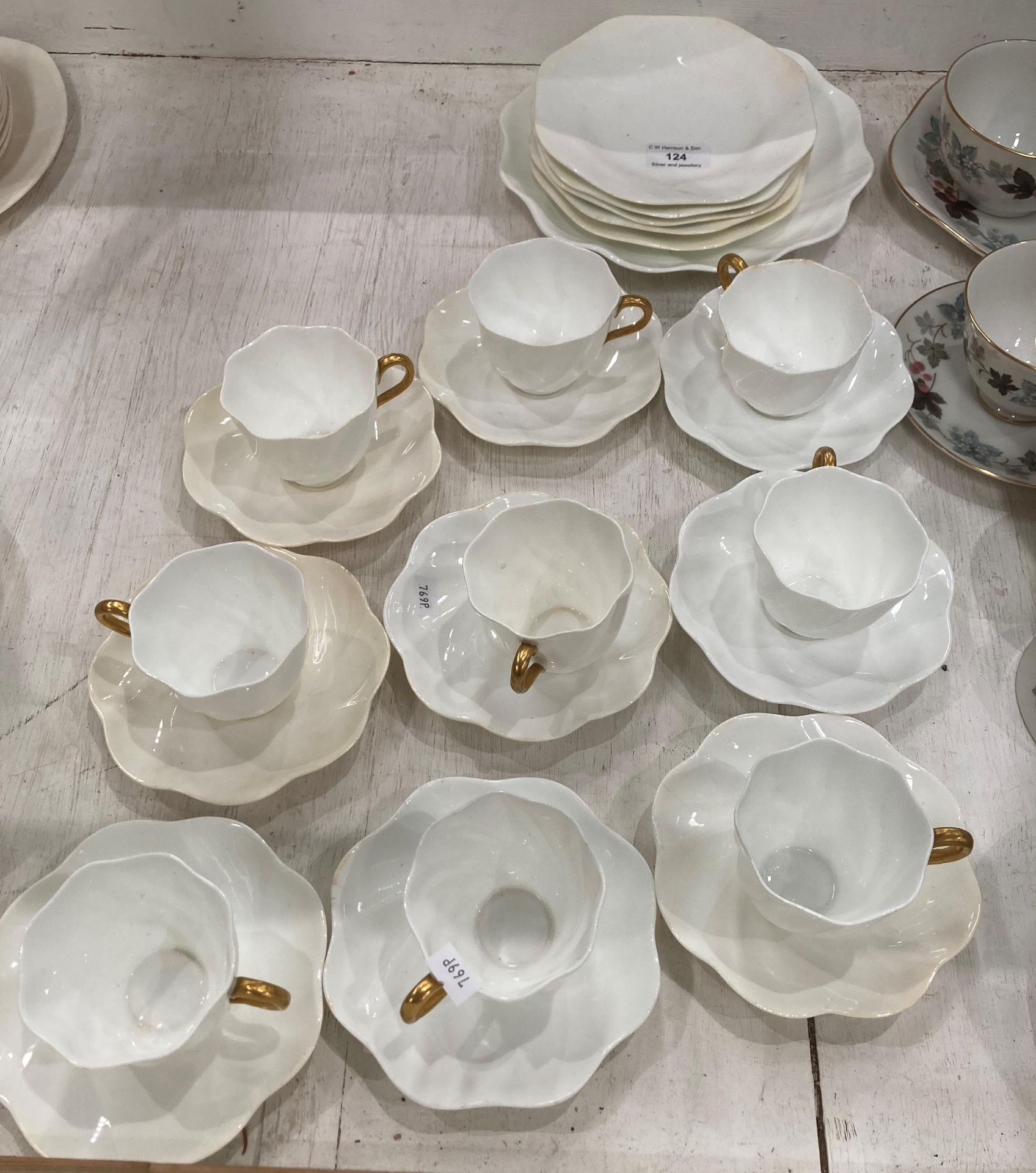 Twenty-four pieces of Coalport white and gold tea service including plates,