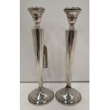 Matching pair of sterling silver candlestick holders with weighted bases 25cm high total weight