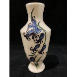 A Moorcroft cream and blue floral glazed vase 16cm high, signed 'HD 2009' to base.