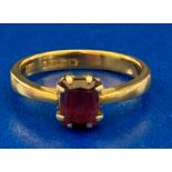 A 22ct yellow gold ring fitted with a rectangular garnet - total weight 3.6 grams, ring size L.