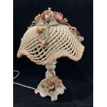 A Capo di Monte floral patterned table lamp with basket weave shade - one flower to shade is