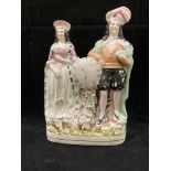 A Staffordshire style figure group 'beau and lady' 23cm high