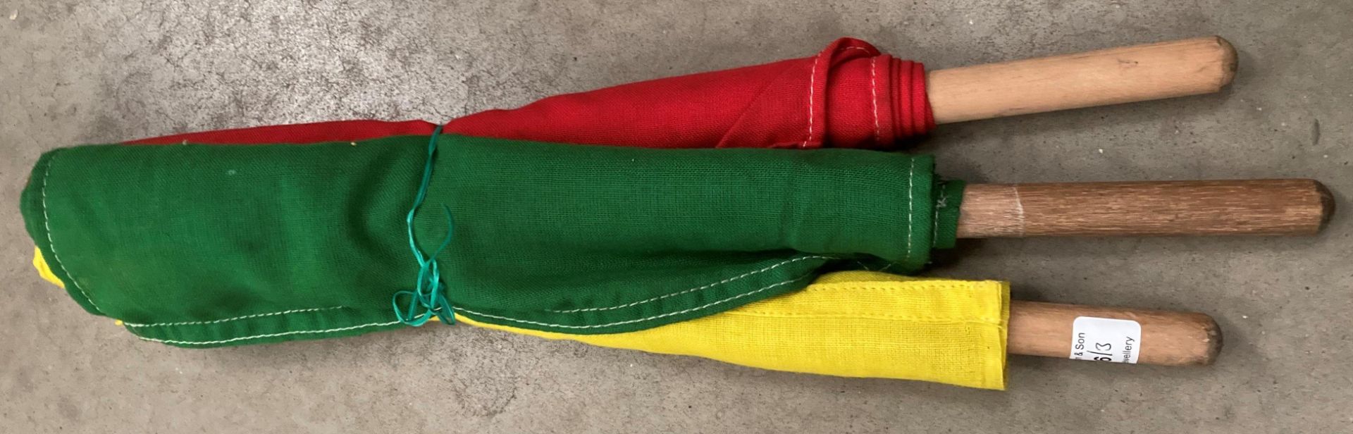 Three Station Masters flags - red, yellow and green.