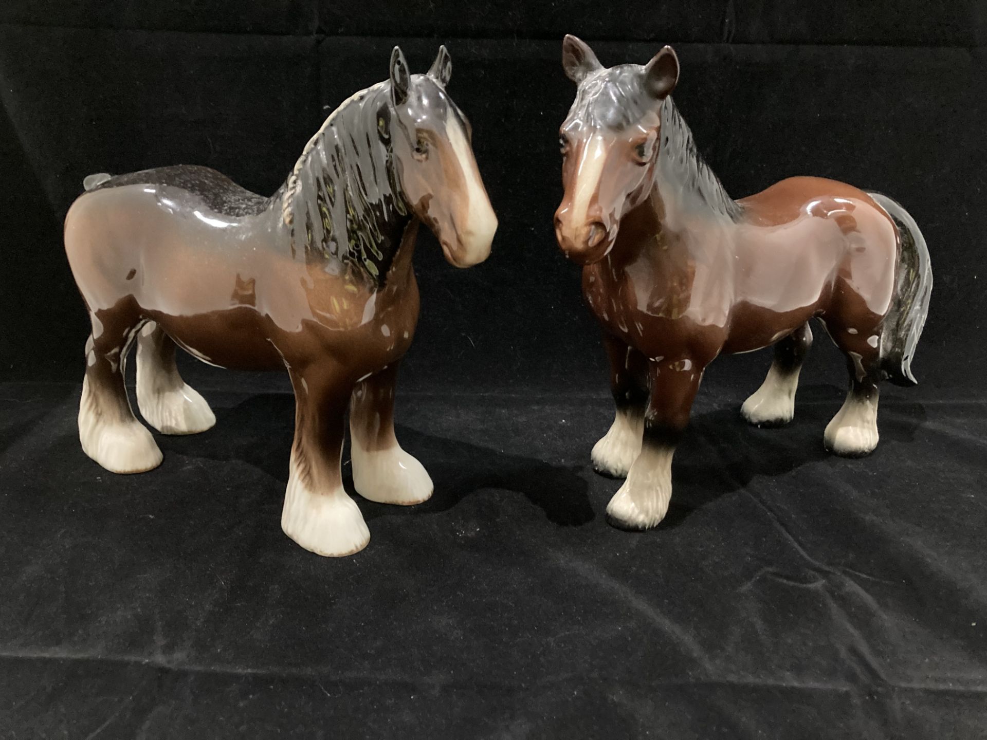 A Beswick brown shire horse 26cm x 23cm high and another brown shire horse (2)