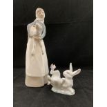 A Lladro figurine of a young girl holding a lamb and a Lladro rabbit with a butterfly No 5888 (2)
