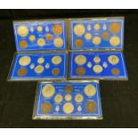 Five Great Britain packaged King George V coin sets - 1921 and 1922 (eight piece), 1923,