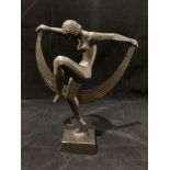 A modern Deco style metal ware naked female statue 24cm high