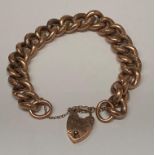 A 9ct gold hollow link bracelet with a padlock clasp - 28 grams