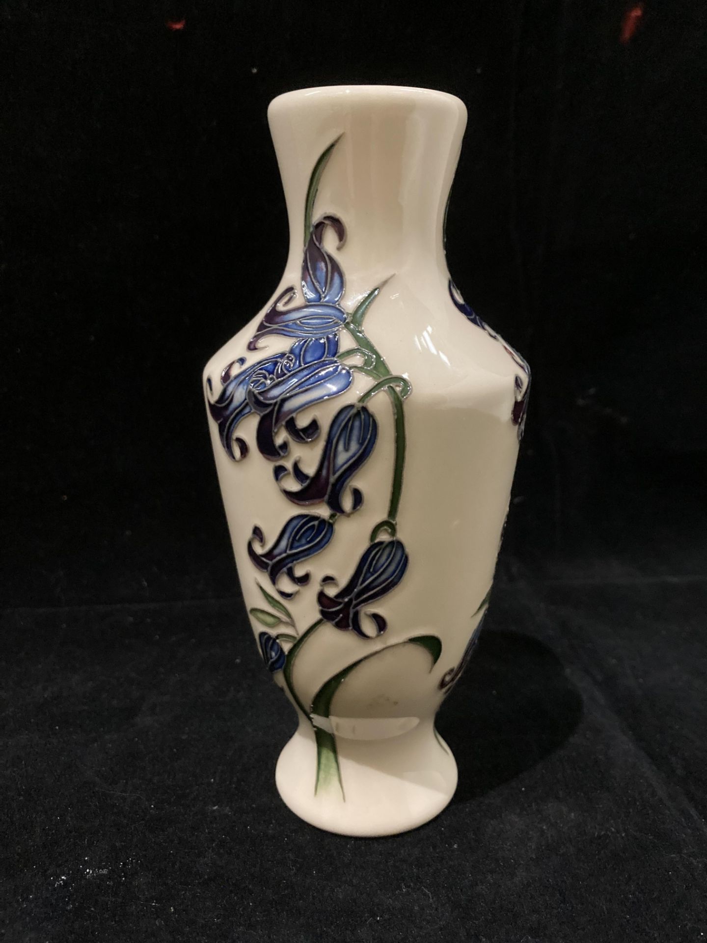 A Moorcroft cream and blue floral glazed vase 16cm high, signed 'HD 2009' to base. - Image 3 of 4