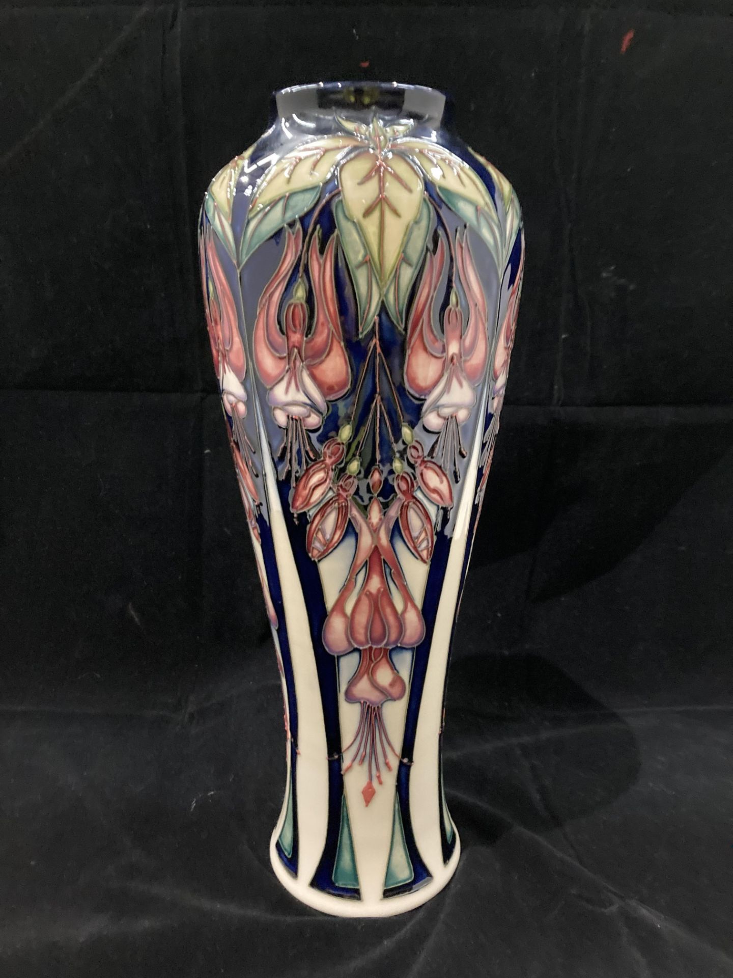 A Moorcroft trial vase in cream, blue and pink glazed pattern - signed to base 'PT Trial 28.07.