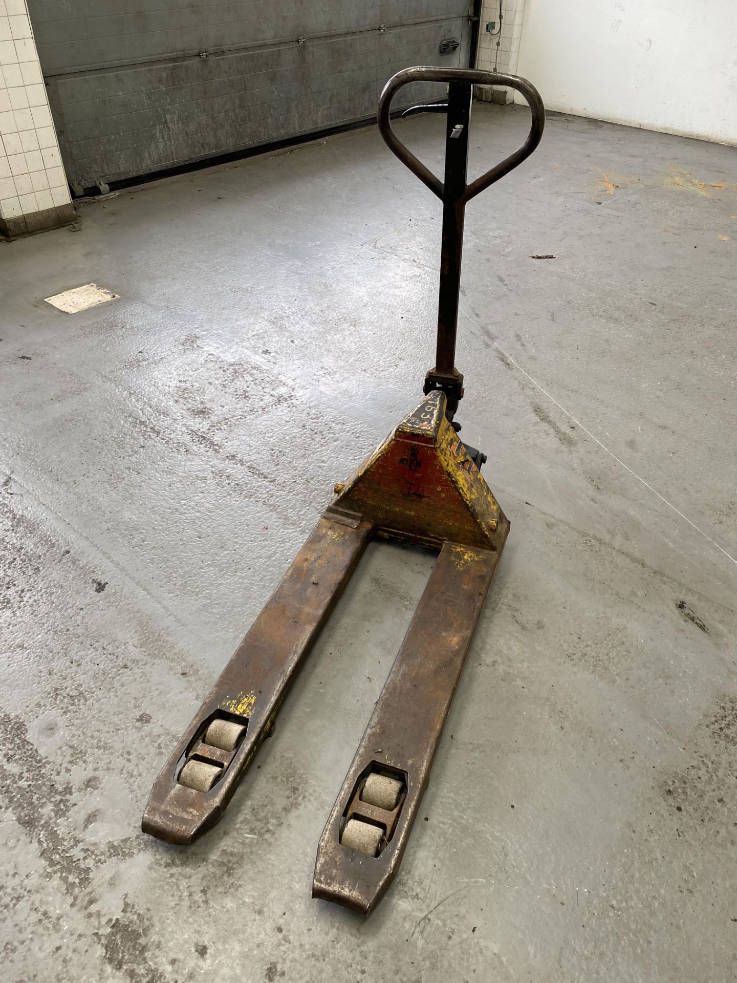 A Yellow 2000kg Pallet Truck