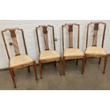 Four wooden dining chairs with carved panel to back,