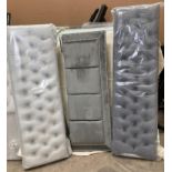 Three assorted grey bed foot boards, various styles.