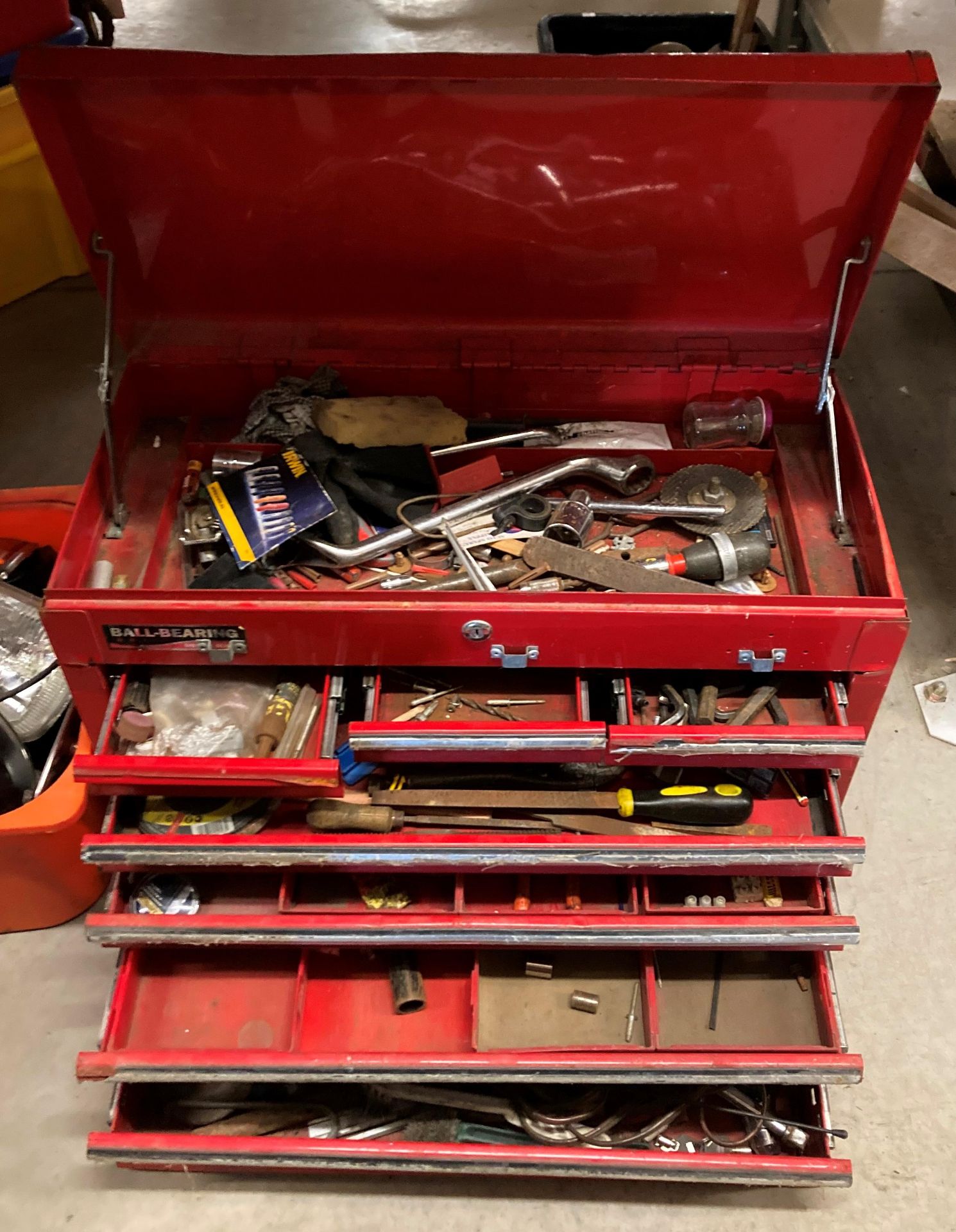 A Ball Bearing red metal seven drawer (various sizes) lift top portable toolbox in as seen