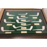 Selection of clay pipes in wall hanging wooden display box with glass face U05