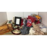 Twenty plus items including three pashminas, two marquetry pictures, two photo frames,