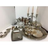 Eighteen pieces of plated and other metalware including three armed plated candelabra,