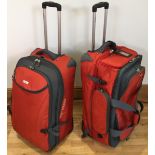 Two orange and grey fabric High Sierra wheeled extendable travel bags 70x50x35cm with three