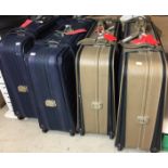 Four Antler wheeled suit cases - two blue 74x53cm,